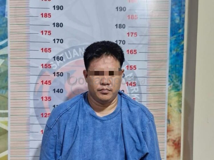 Tersangka Agusman.